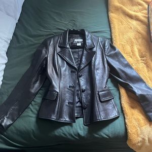 Super cute bebe leather jacket! Fits like a small. 100% leather exterior.